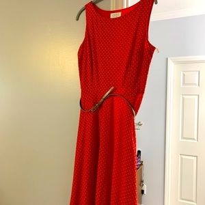Woman's sleeveless polka dot red dress